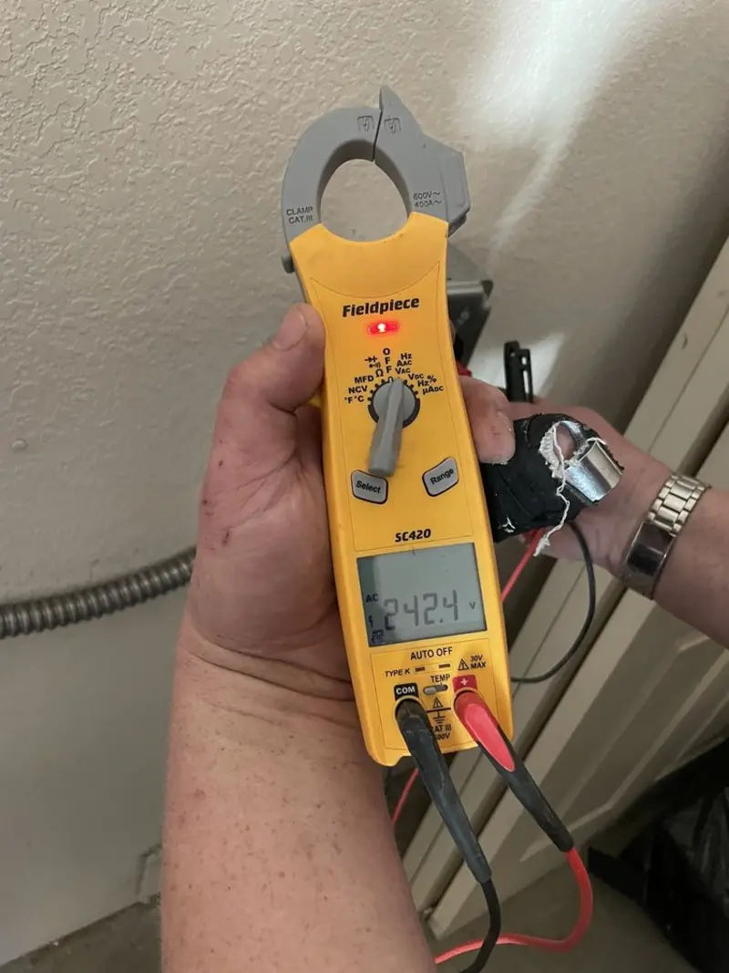Voltage testing with clamp meter during Ceiling Fan Installation in Granville
